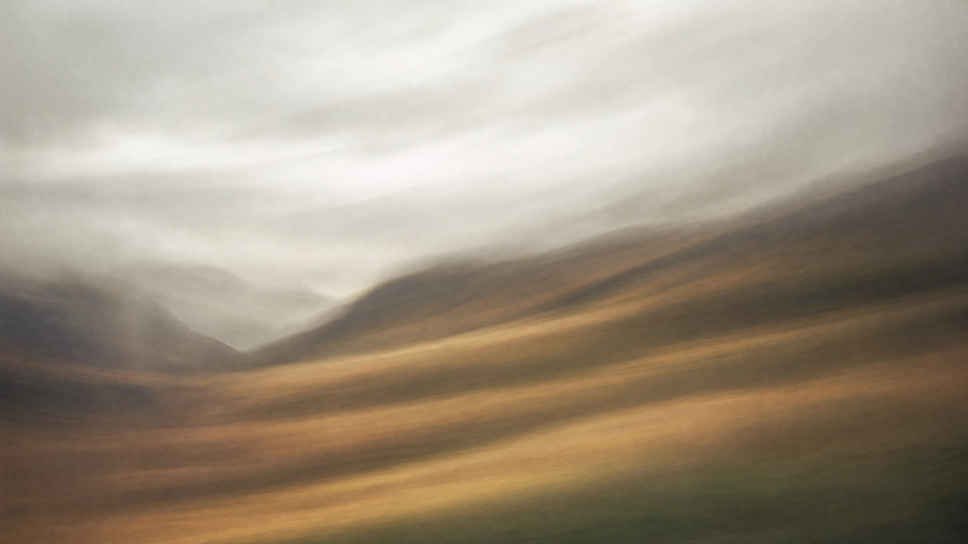 A moody windswept landscape behind the publishing controls